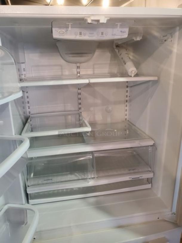 Whirlpool GX5FHTXVQ06 French Door Refrigerator, 24.8 cu. ft., adjustable shelving, spacious interior, visible control panel.