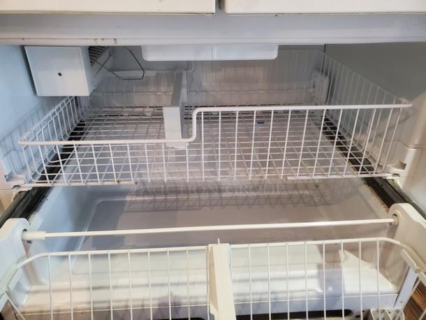 Whirlpool GX5FHTXVQ06 24.8 cu. ft. French Door Refrigerator, interior view, white wire shelves, clean condition.