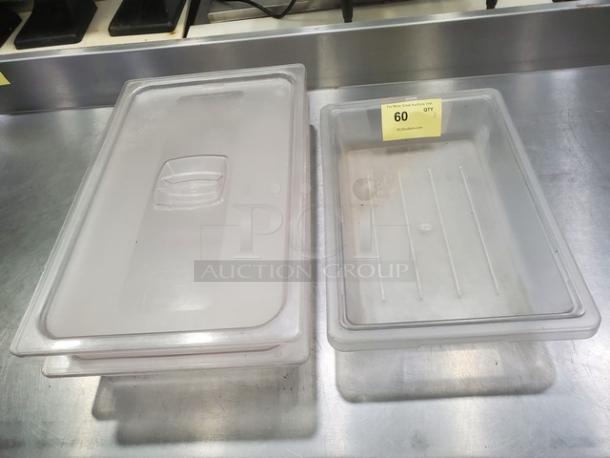 Lot of 3 plastic food pans; two have lids. Clear material, gently used. Ideal for food storage. Quantity tag reads "60 QTY."