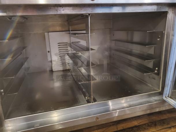 Shelley Steel by Delfield 5 Well Electric Steam Table, missing one knob, needs new plug. Interior racks visible.