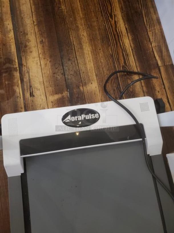 Aora Pulse Compact Treadmill, sleek design, black and white finish, visible control panel, compact and ideal for small spaces.