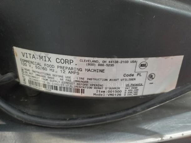 Vitamix VM0126 commercial blender label. Shows model, voltage (120V), frequency (50/60 Hz), and amperage (12A).