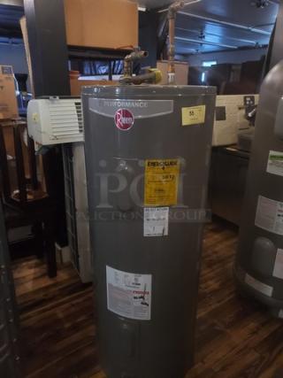 Rheem Performance 80 Gal. Water Heater, Model XE80T06ST45U0, in good condition. Visible energy guide label.