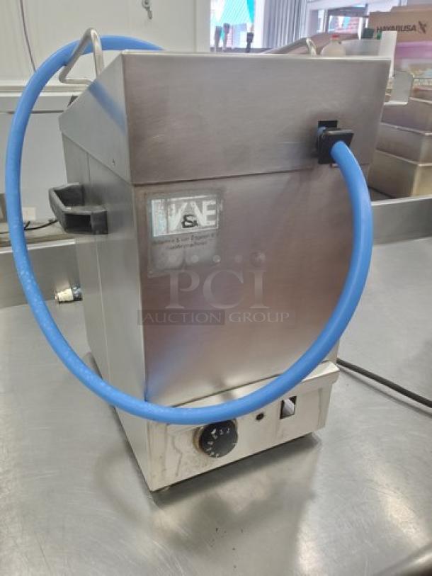 Apex Table Top Jelly Sprayer with blue hose, stainless steel finish. Unknown condition, sold as is.