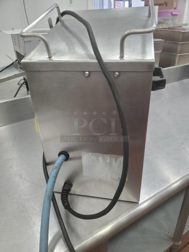 Apex Table Top Jelly Sprayer, stainless steel, unknown condition, features hoses and handles, sold as is.