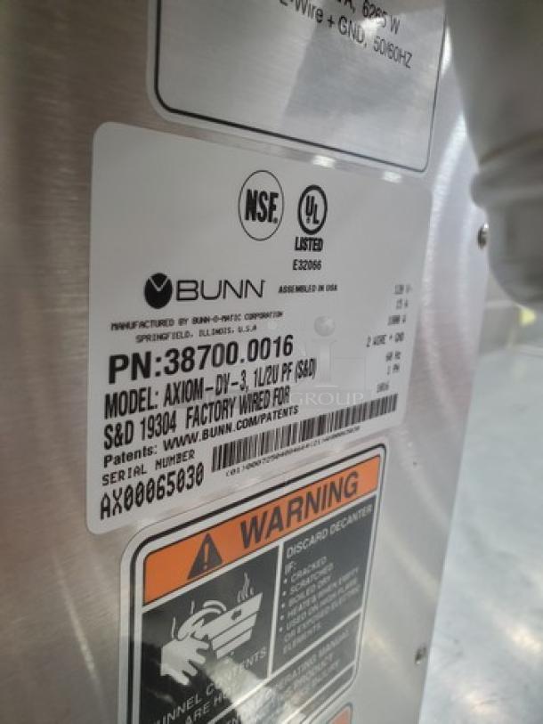 Bunn AXIOM DV-3 Dual Volt coffee maker, 2 upper/1 lower warmer, model AXIOM-DV-3, NSF/UL certified label visible.