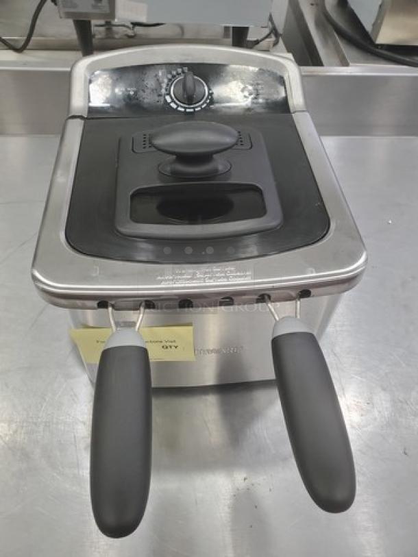 Farberware 103736 countertop fryer, stainless steel with black handles, adjustable temperature dial, appears in good condition.