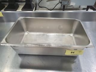 Stainless steel Amko food pan, rectangular, used condition, visible scratches. Auction tag reads "84 QTY 1."