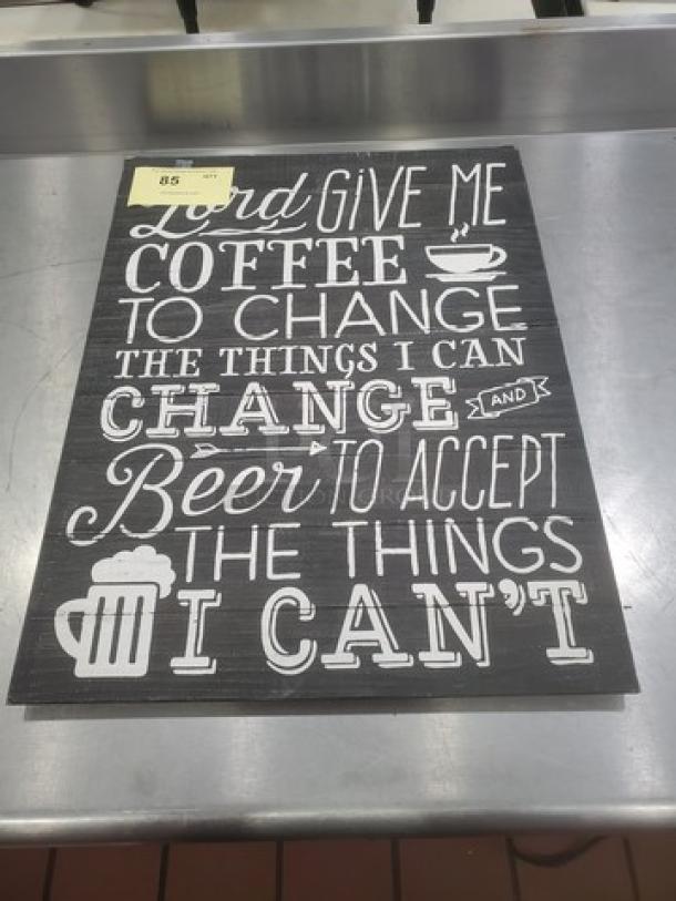 Decorative sign with text: "Lord give me coffee to change the things I can and beer to accept the things I can't." Black background, white lettering.