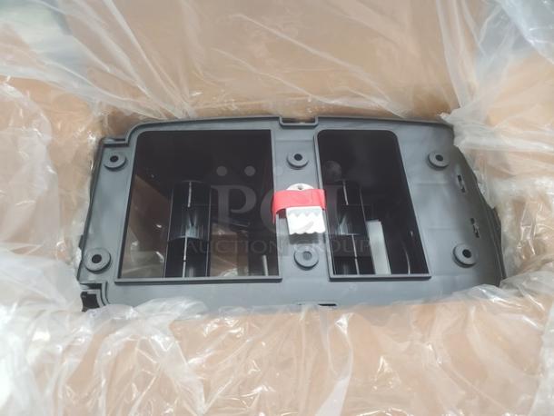 San Jamar Duett Tissue Dispenser, black plastic, dual-roll capacity, new condition, original packaging, wall-mount design.