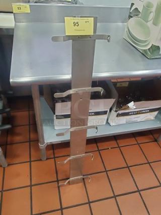 Stainless steel rack with four hooks, good condition, suitable for kitchen or storage, auction tag indicating item number 95.