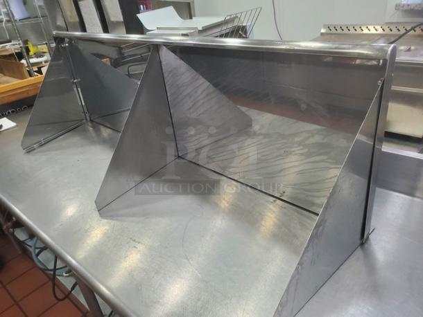 Gridmann stainless steel wall mount shelf, durable, sleek, used condition. Features triangular supports for stability.