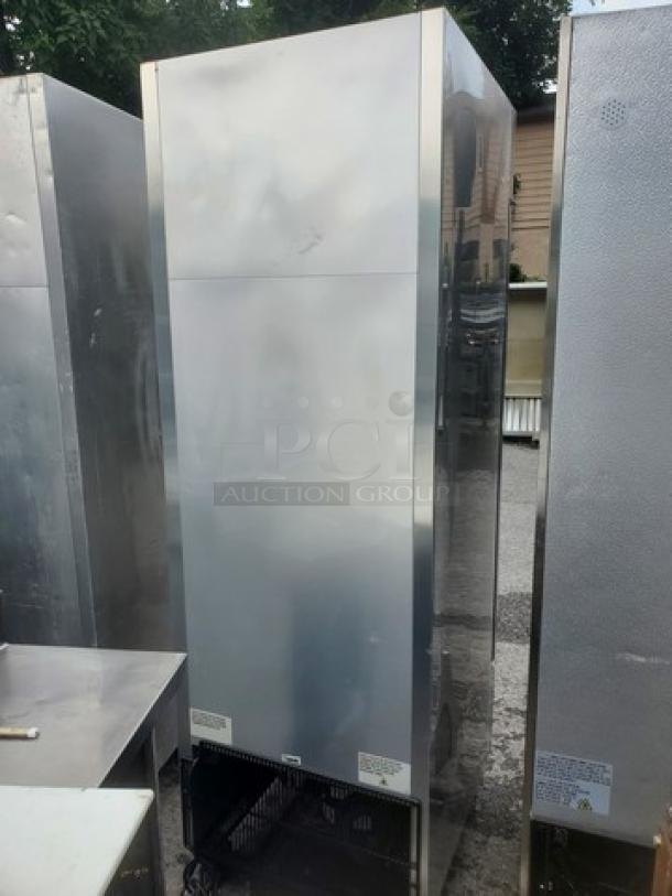 True T-23 Reach-In Refrigerator, stainless steel, upright model, visible exterior wear, commercial use.