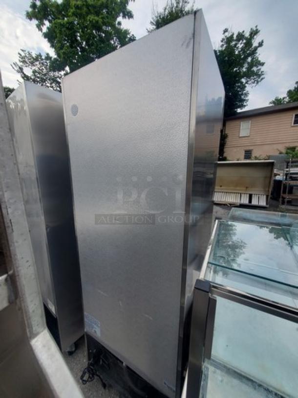 Avantco 178A19FHC solid door reach-in freezer, stainless steel exterior, in used condition, visible label with model info.