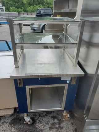 Colorpoint K28-ST Portable Work Counter, stainless steel, includes glass display shelf, lower storage, in used condition.