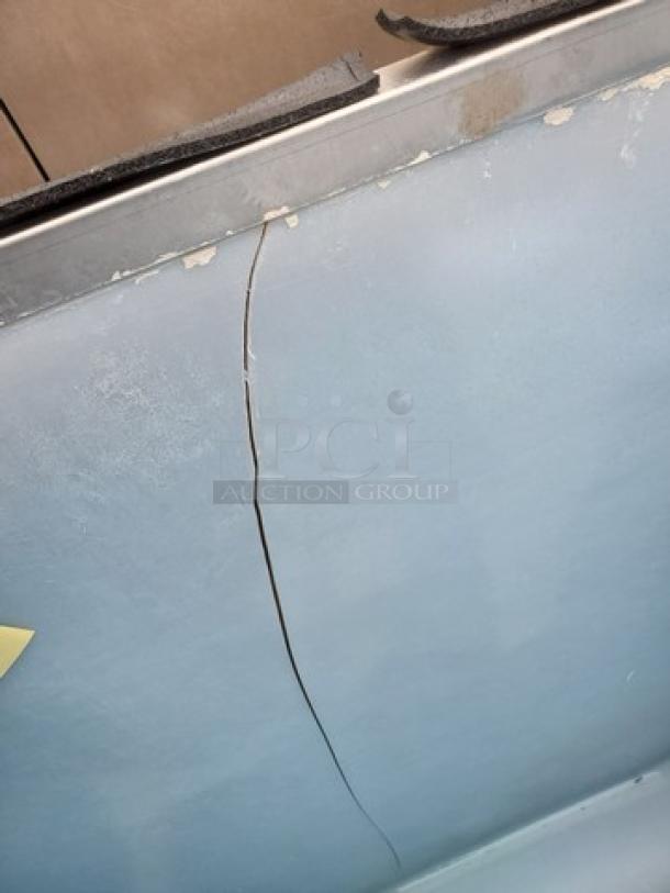 Manitowoc C400 ice maker storage bin, visible crack on surface, stainless steel top, used condition.