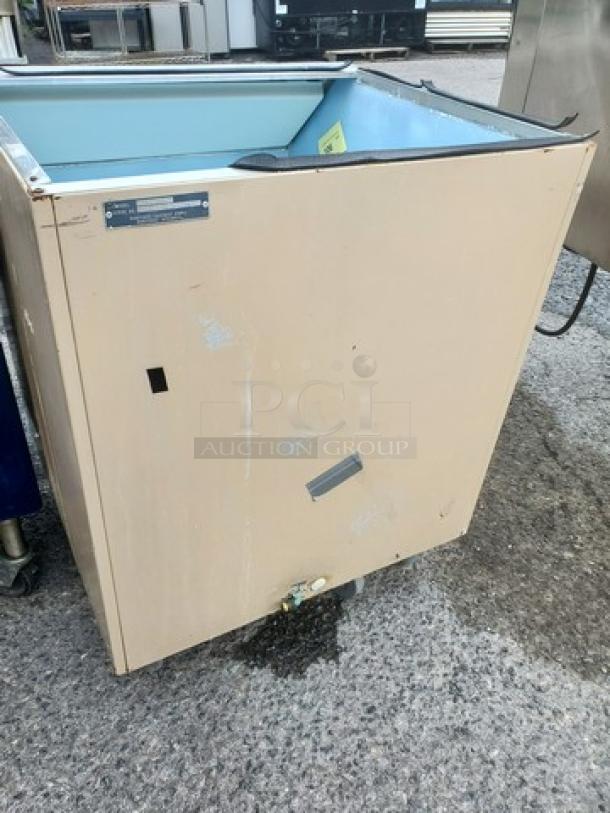 Manitowoc C400 Top Mount Ice Maker Storage Bin, beige, used condition, visible wear, model label present.