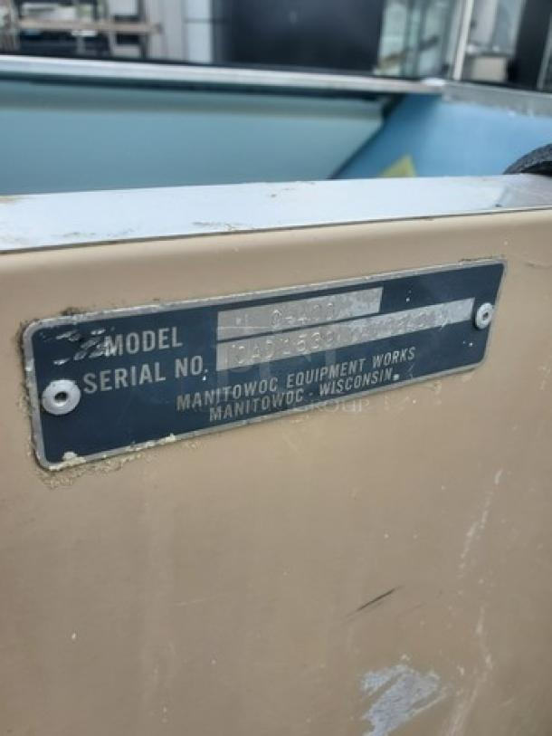Manitowoc C400 top mount ice maker storage bin, metal body, label with model and serial number visible, used condition.