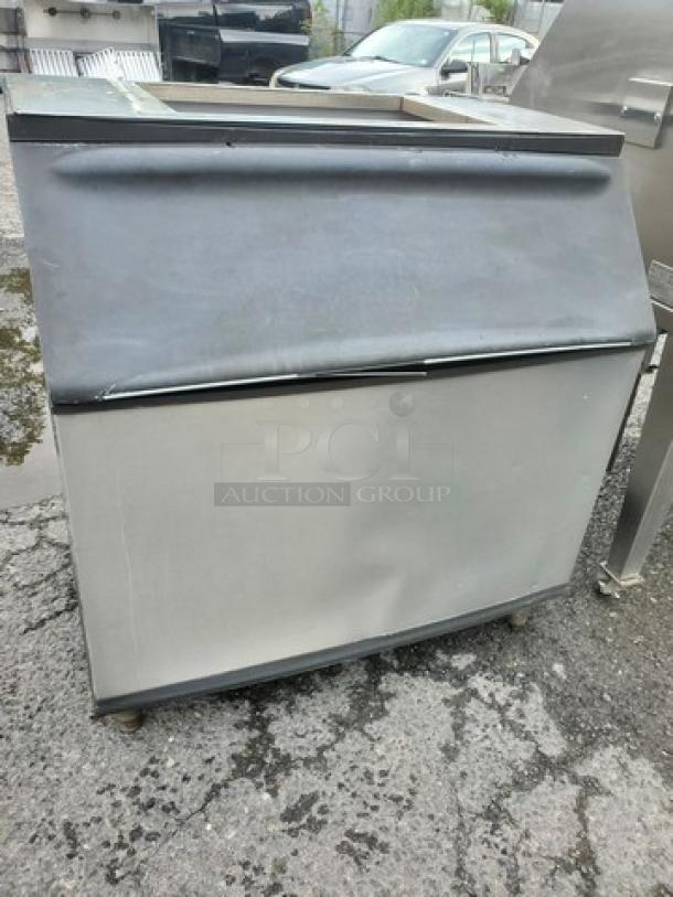 Manitowoc B-970 ice bin, 710 lb. capacity, stainless steel, visible wear, model B-970, ideal for commercial use.