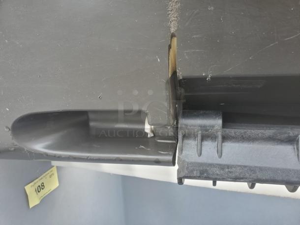 Manitowoc B-970 Ice Bin, 710 lb. capacity, durable black and grey construction, slight wear, model label visible.