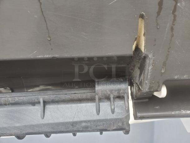 Manitowoc B-970 ice bin corner detail, shows wear and water drips. Bin capacity: 710 lb. Model B-970.