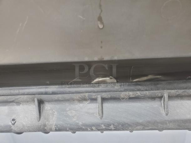 Manitowoc B-970 Ice Bin, 710 lb capacity, interior view showing wear and minor scratches.