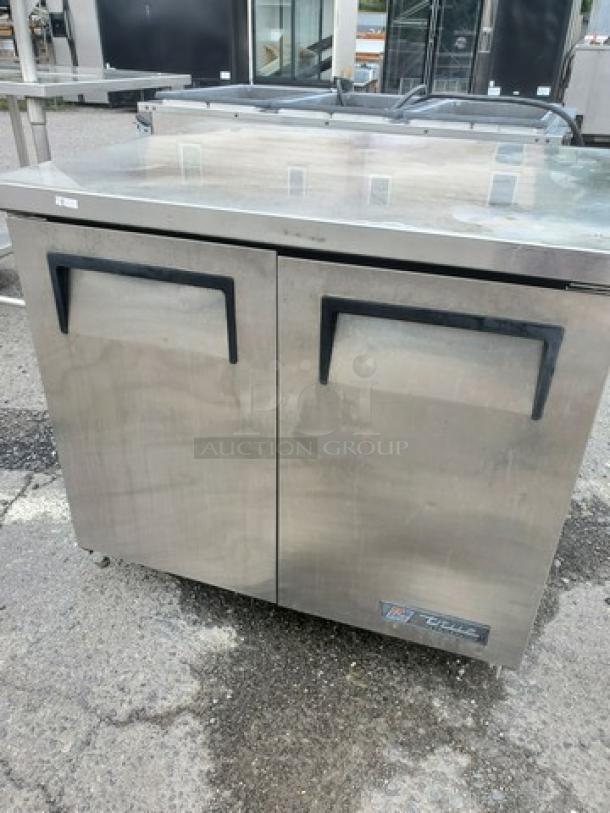 True TUC-36 undercounter refrigerator, stainless steel, dual-door, black handles, visible True logo, used condition.