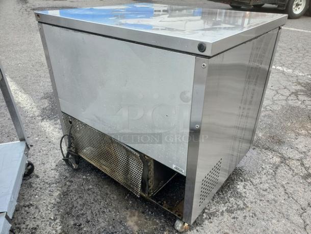 True TUC-36 undercounter refrigerator, stainless steel, used condition, visible wear, model label on corner.