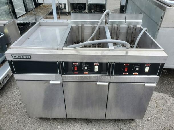 Hobart HFD50 Electric Fryer, model HFD50, 208v, 3 PH. Features dual fry baskets, stainless steel build, control knobs, and Hobart branding.