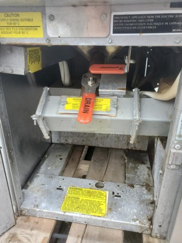 Frymaster Electric Fryer FH22BLCSC in used condition, 480V, 60 Hz, 3 PH. Features visible drain lever and caution labels.