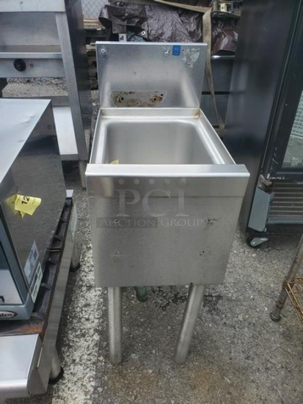 Stainless steel one compartment sink with backsplash, used condition, sturdy legs, ideal for commercial kitchens.