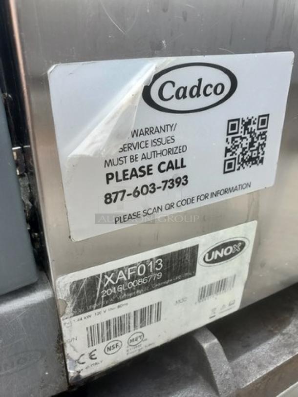 Cadco Uno-X XAF013 countertop convection oven label detailing model, warranty contact, and QR code for further info.
