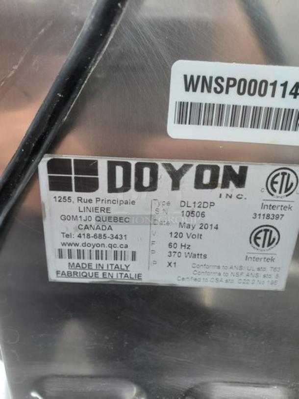 DOYON DL12DP countertop 12" dough roller sheeter, unknown condition. Tag indicates model, make, voltage, and origin.