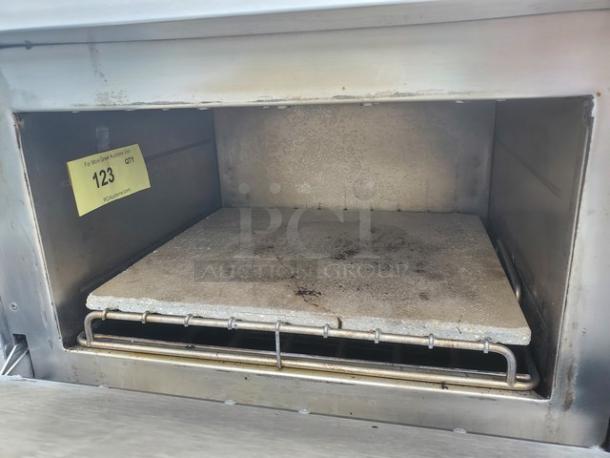 Turbochef Tornado NGCD6 convection oven interior; shows wear. Model label "123" visible. High-speed, rapid cook features.