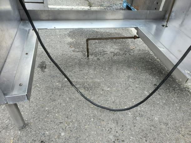Delfield EHEI48C 48" hot food table in stainless steel. Features visible wiring and sturdy metal legs. Good condition.