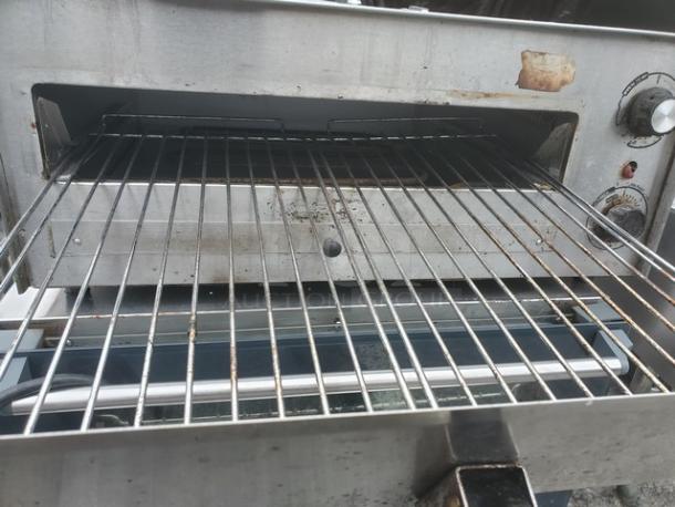 Tomlinson Industries Fusion Premium Pizza & Snack Oven, Model 515, countertop design, visible wear, stainless steel finish.