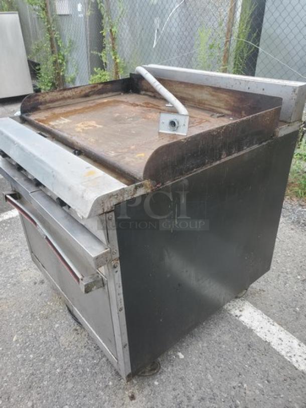 Hobart HCR421 36" electric range with convection oven, 208V, 3 PH, 60 Hz, in used condition. Features stainless steel exterior.