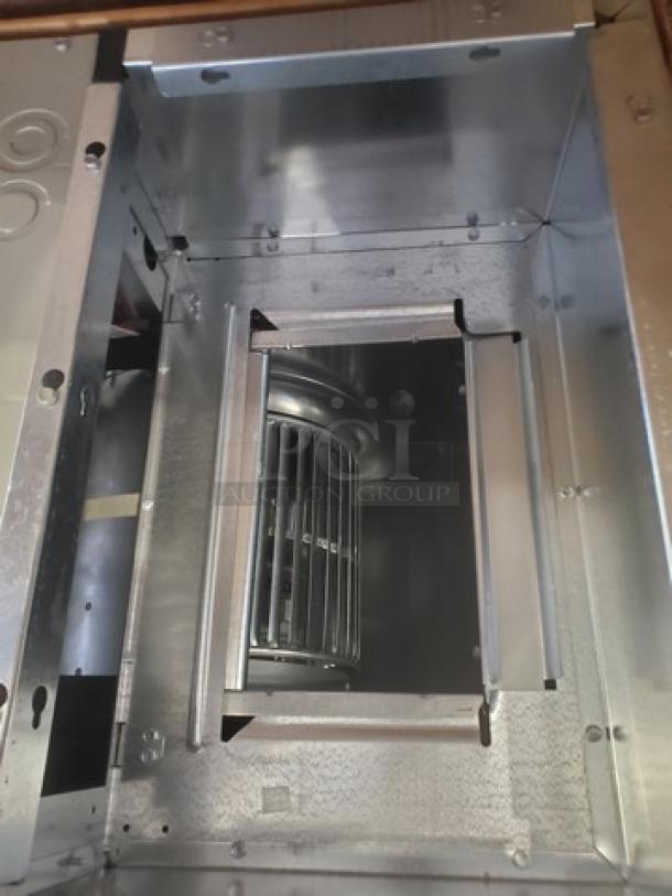 AC Air Handler 2TEC3F24B1000A in box, never used. Features durable metal construction and visible fan component.