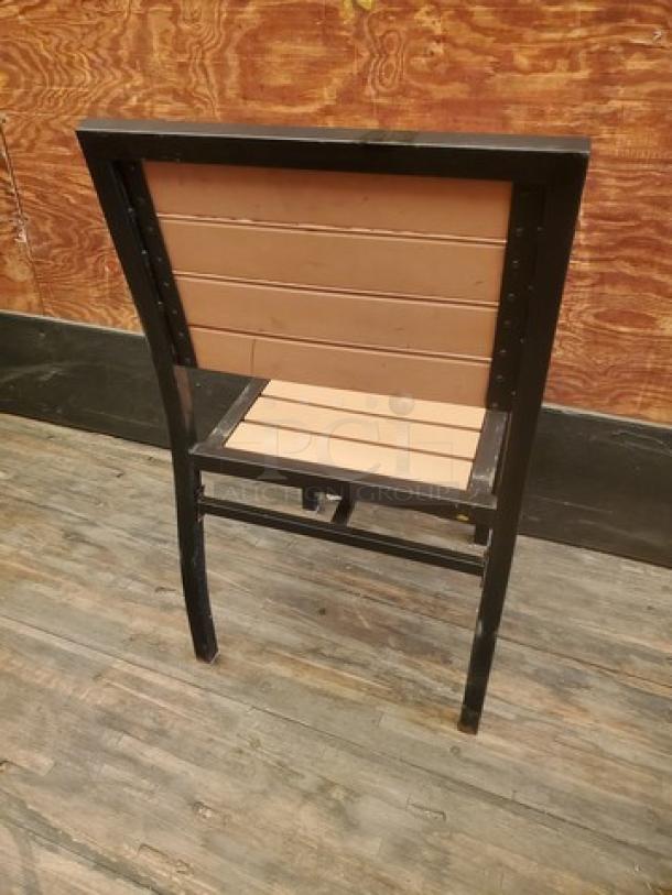 Lot of 4 patio chairs with black frames and brown slat seats and backs. Minimal wear. Ideal for outdoor use.