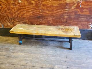 Lot of 2 wooden benches with rustic wear, natural wood grain, sturdy black metal legs, suitable for indoor or outdoor use.