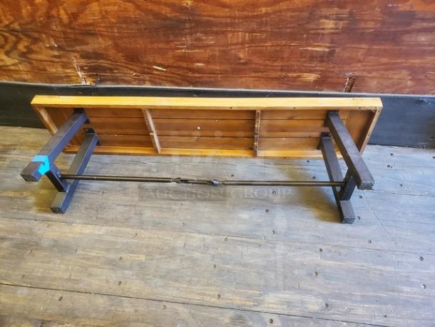 Lot of 2 wooden benches with sturdy metal supports. Natural wood finish, minor wear. Ideal for rustic or industrial decor.