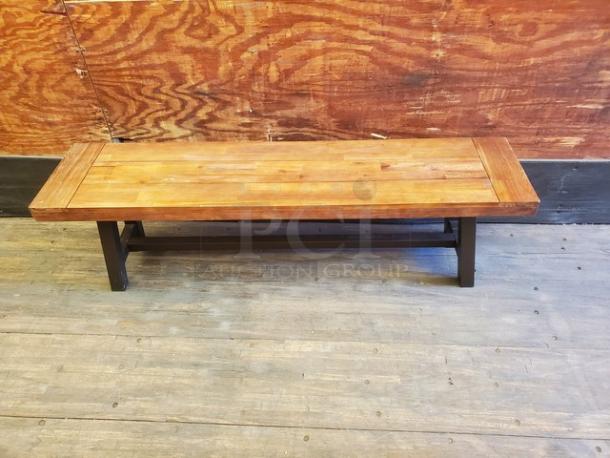 Lot of 2 wooden benches, featuring solid wood tops and sturdy black legs. Excellent condition with a smooth finish.