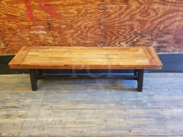Lot of 2 wooden benches with rectangular tops and sturdy black legs. Good condition, natural wood finish.