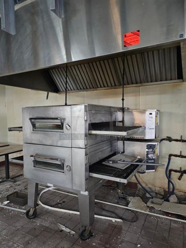 Lincoln Impinger double stack natural gas pizza conveyor oven, Model 1600-015-AR, stainless steel, on wheels, used condition.