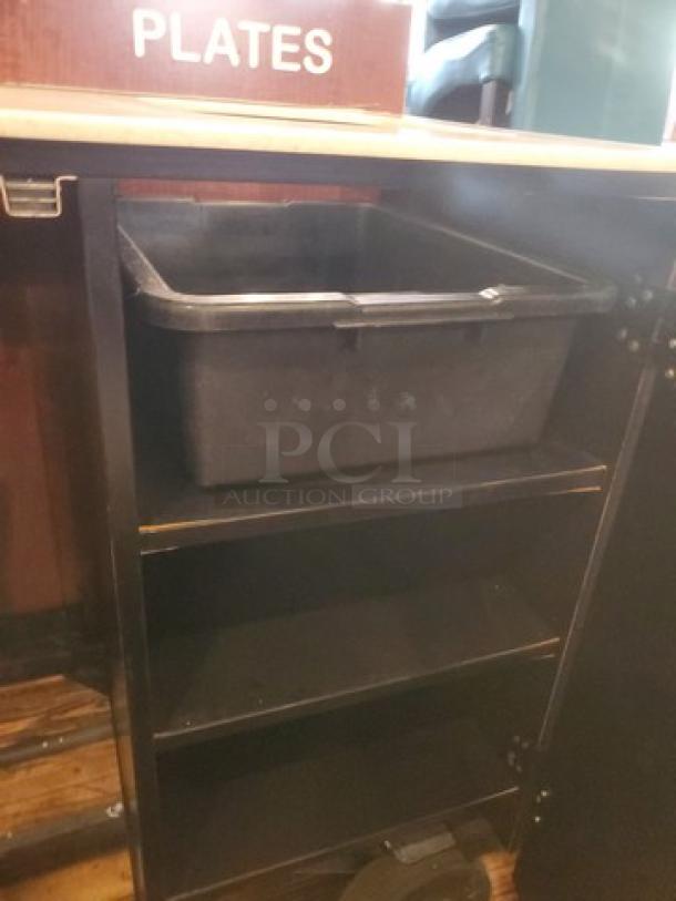 Industrial waste station with labeled plate slot, storage shelves, and removable black bin; suitable for restaurant use.