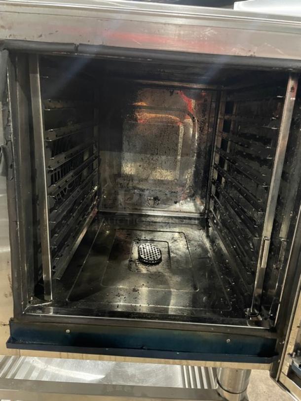 Alto-Shaam 2017 CTC7-20E commercial combi oven, stainless steel, digital controls, electric, single-undershelf stand, on legs.