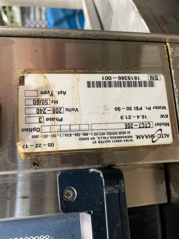 Alto-Shaam model CTC720E label, showing voltage 208-240V, 3-phase, SN 1819386-001, stainless steel with some discoloration.