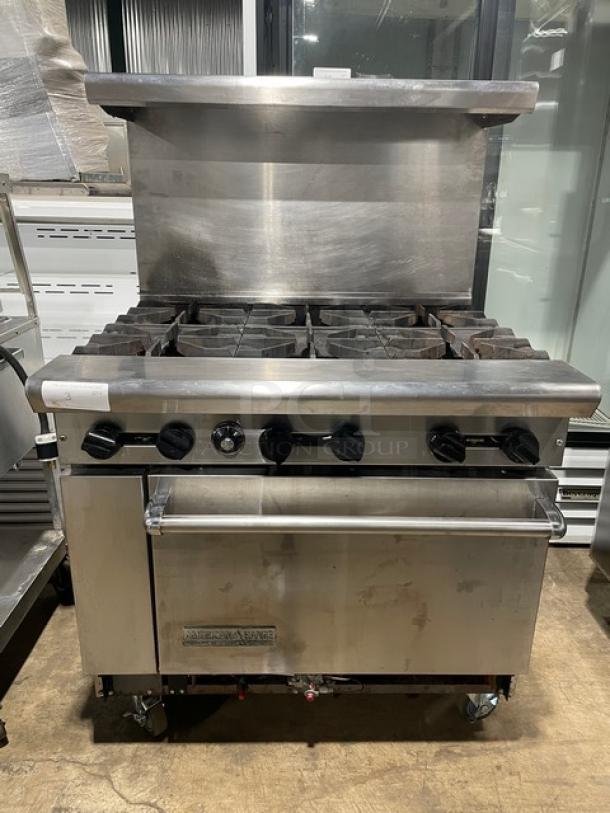 American Range stainless steel 6-burner gas range/oven combo with backsplash, overhead salamander shelf, wired racks, on casters.
