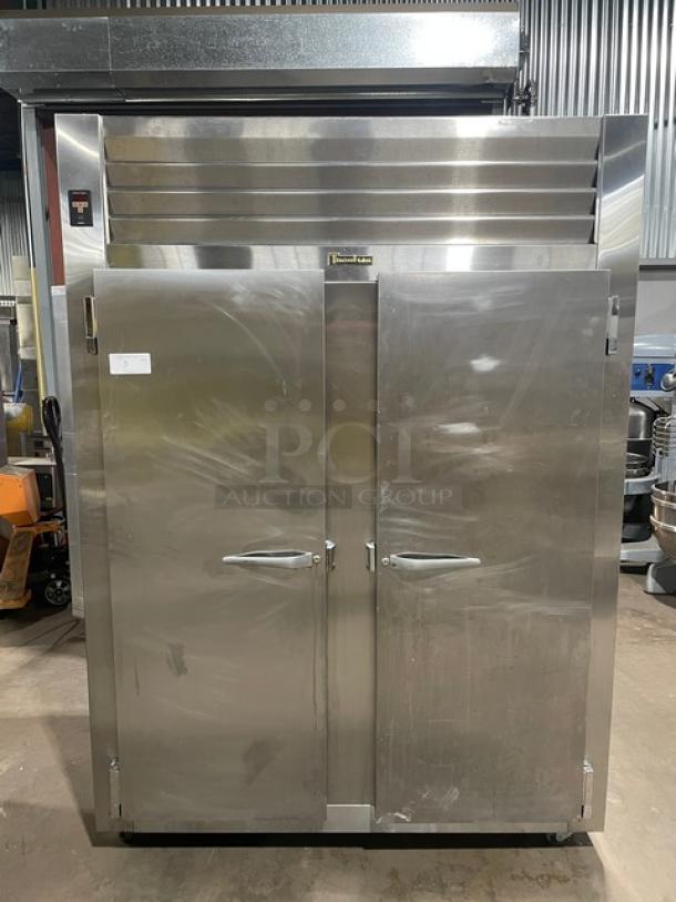 Traulsen Spec-Line stainless steel 2-door reach-in freezer, model RLT232WUTFHS, with chrome-plated wire racks, on casters.