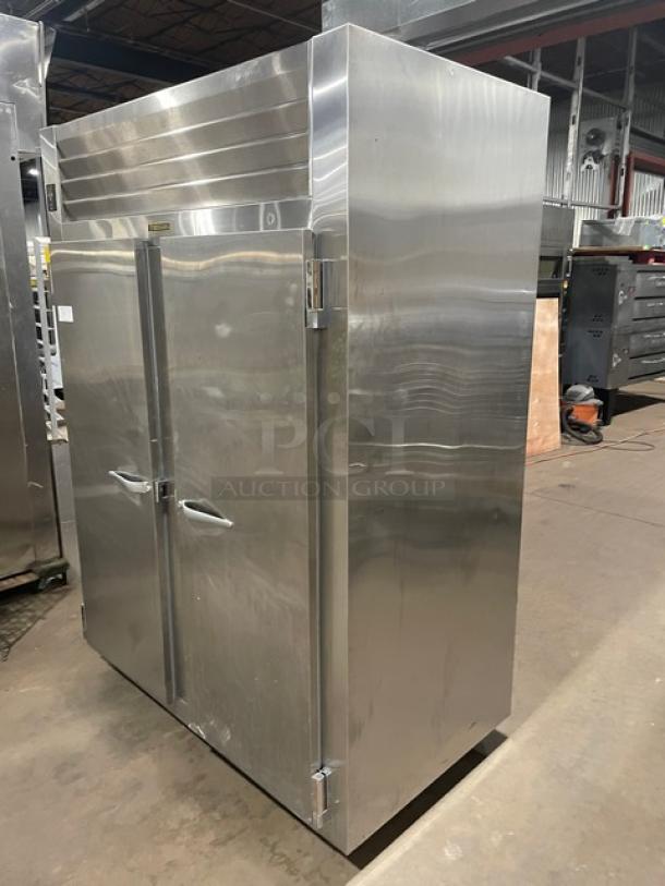 Traulsen Spec-Line stainless steel 2-door reach-in freezer, Model RLT232WUTFHS, with chrome-plated wire racks, on casters.